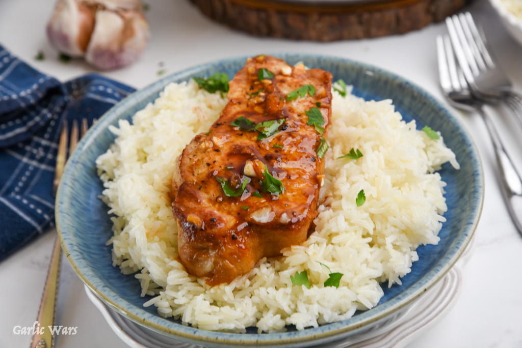 sweet and spicy pork chops served over rice