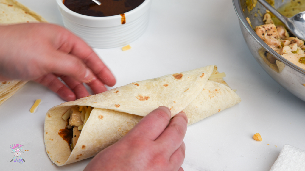 folded tortilla for chicken enchiladas