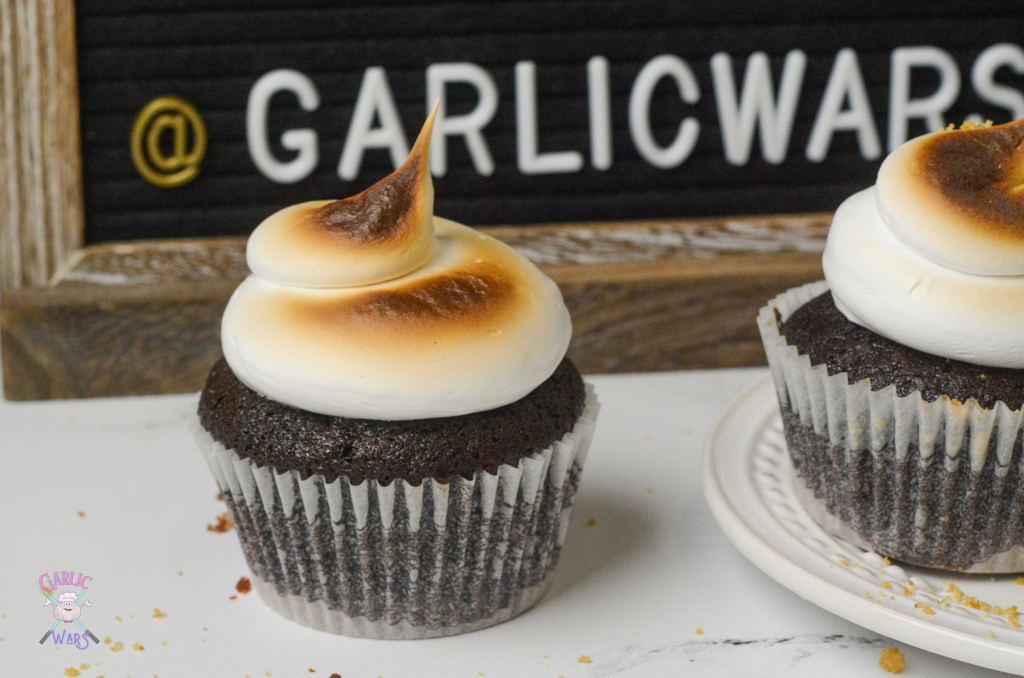 smores cupcakes in front of letterboard sign that reads "garlic wars"