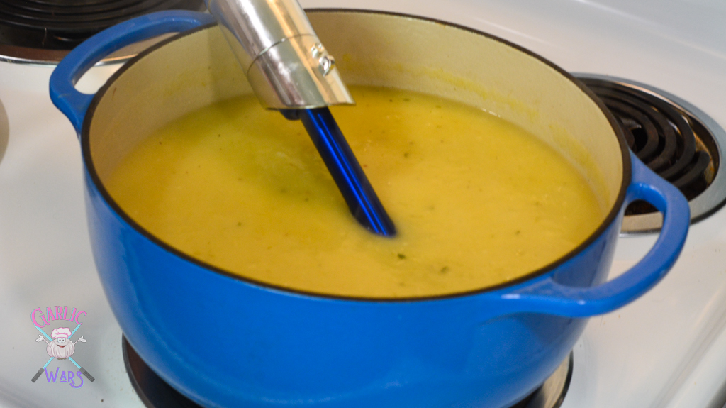 blending soup ingredients using immersion blender