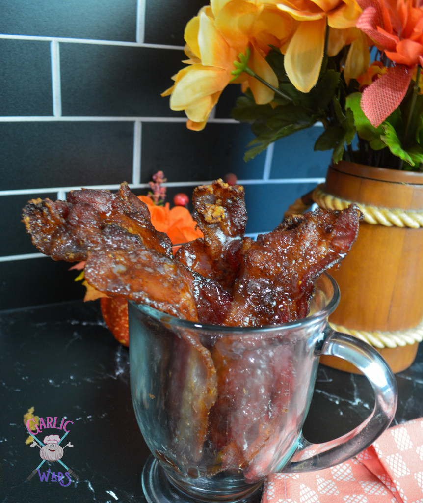 pumpkin spice candied bacon in glass.