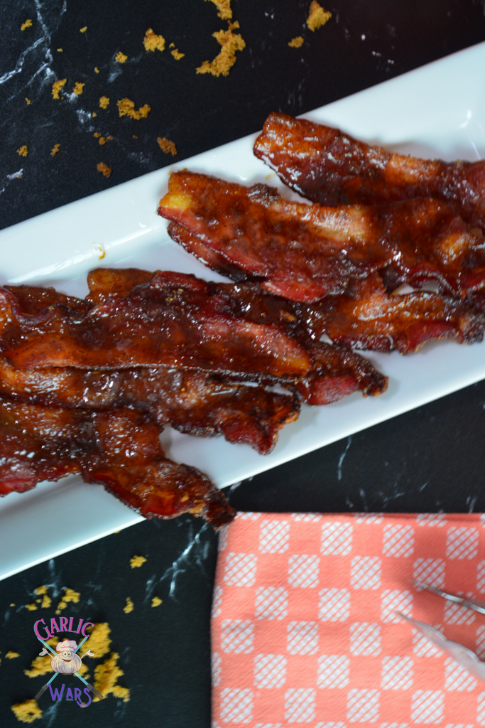 pumpkin spice candied bacon on long white plate