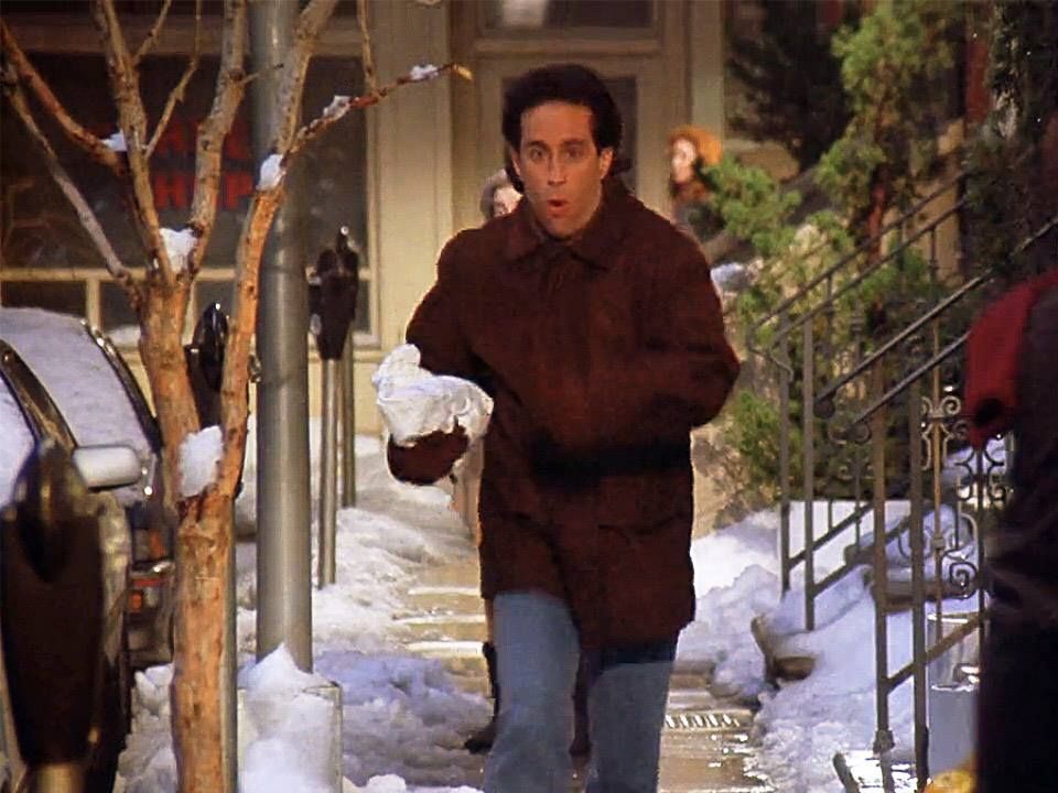 Jerry runs down the street with a marble rye in hand.