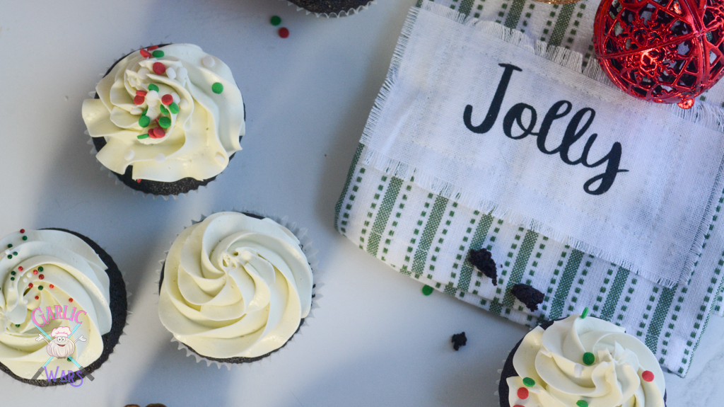 cupcakes with green plaid towel that reads "jolly"