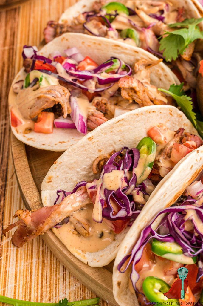 close up of pork tacos with spicy ranch