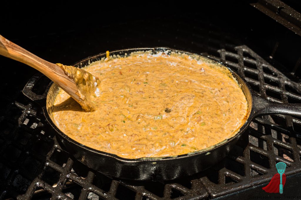 mixing together queso to make it smooth