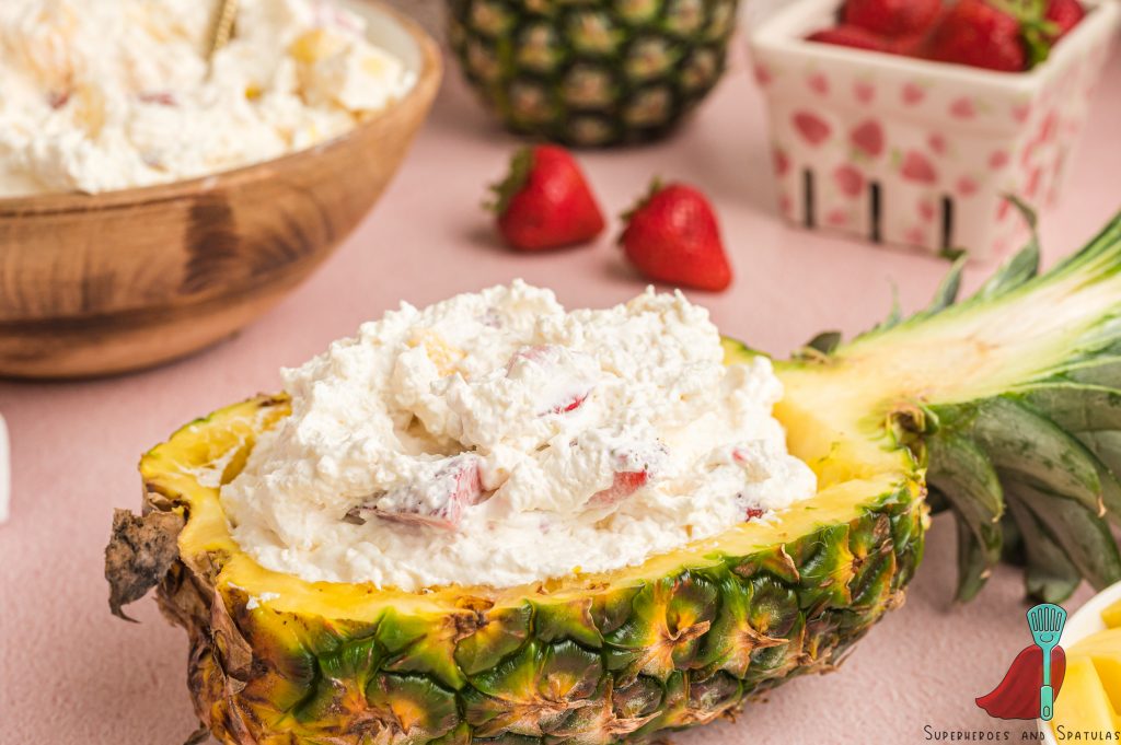cheesecake salad in a pineapple bowl