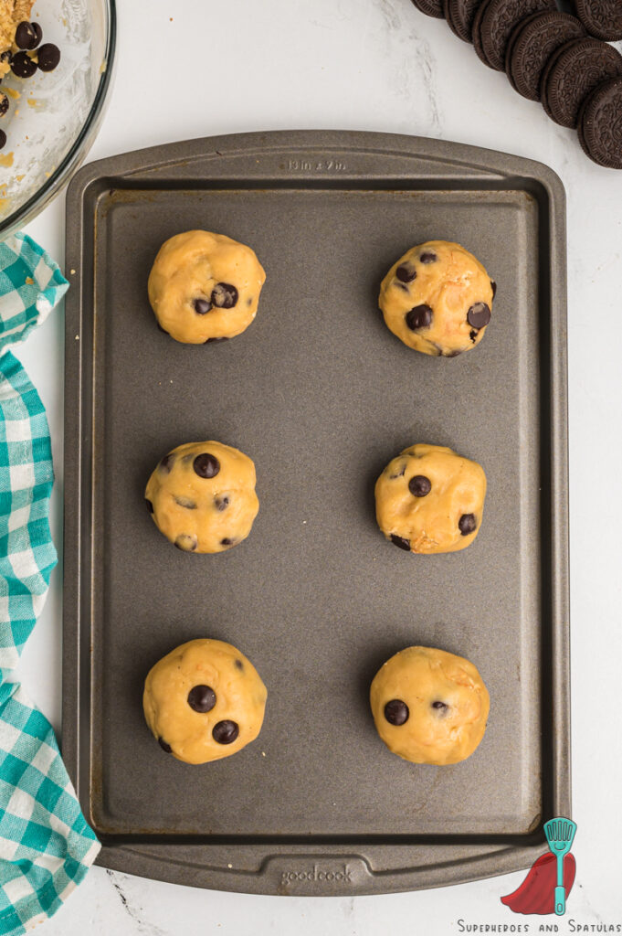 cookie dough balls on a sheet tray